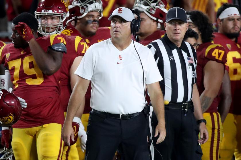 LOS ANGELES, CALIF. - SEP 11, 2021. USC head coach Clay Helton looks at the scoreboard.