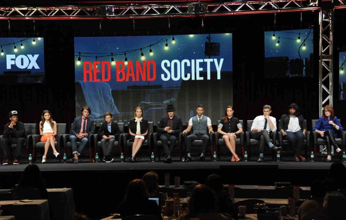 On stage during the "Red Band Society" panel on Sunday are, from left, Astro, Ciara Bravo, Nolan Sotillo, Griffin Gluck, Zoe Levin, Charlie Rowe, Wilson Cruz, Rebecca Rittenhouse, Dave Annable, Octavia Spencer and writer/executive producer Margaret Nagle.