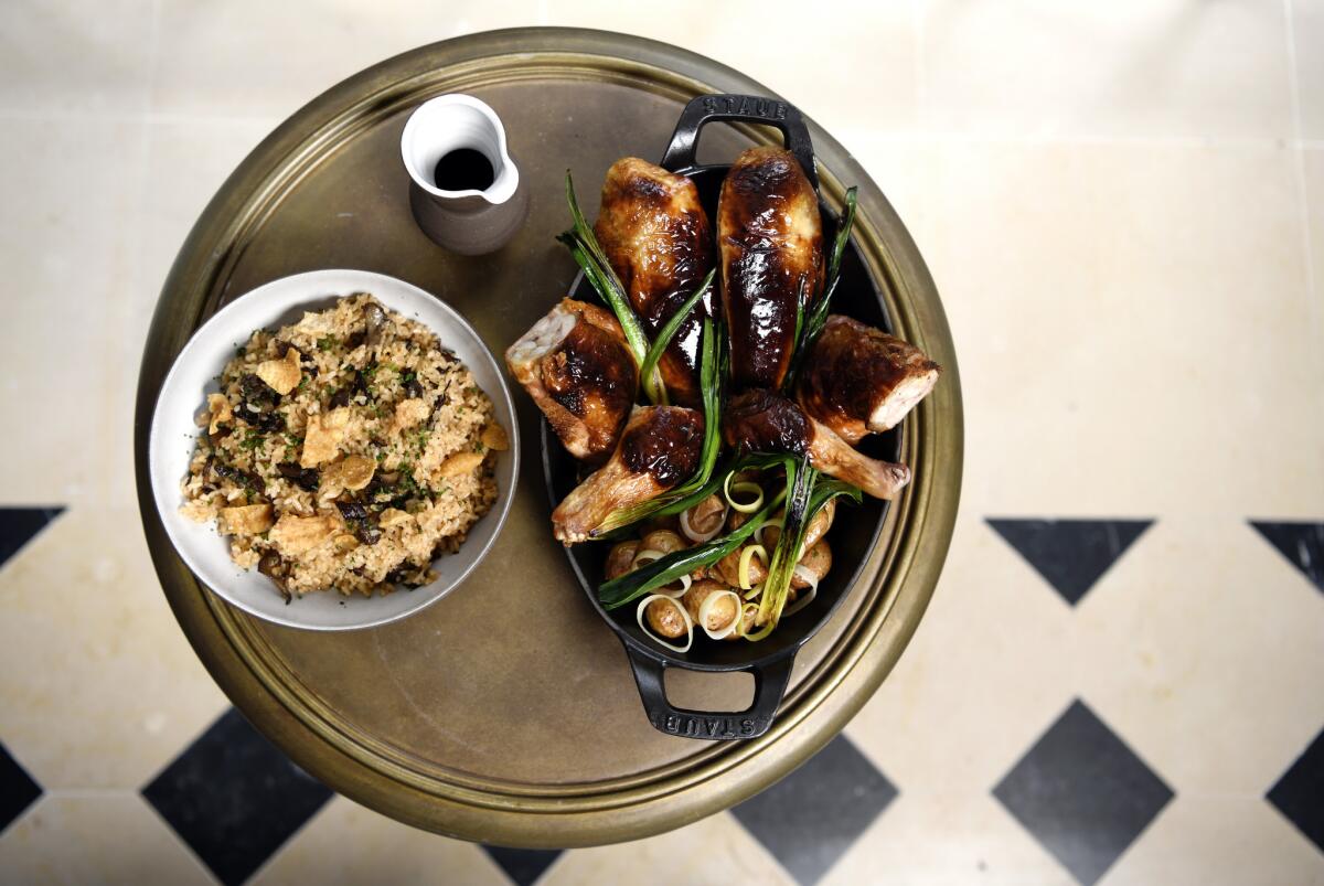 Whole-roasted chicken and stuffing with tomato rice, scallions and crispy chicken skin.