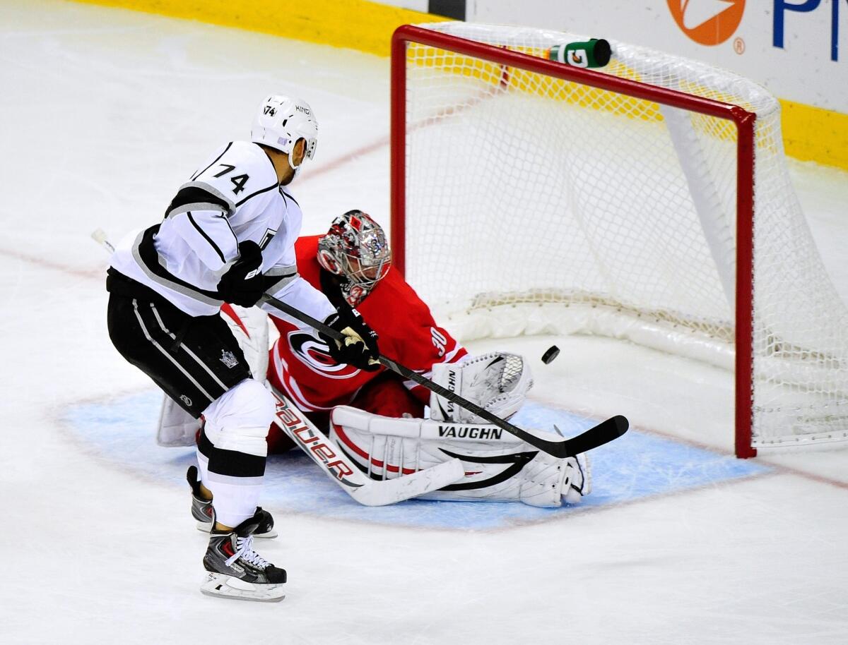 Kings left wing Dwight King scores on Carolina Hurricanes goalie Cam Ward during the Kings' 2-1 win Friday. King is eager to provide more scoring for the Kings after having a productive training camp.