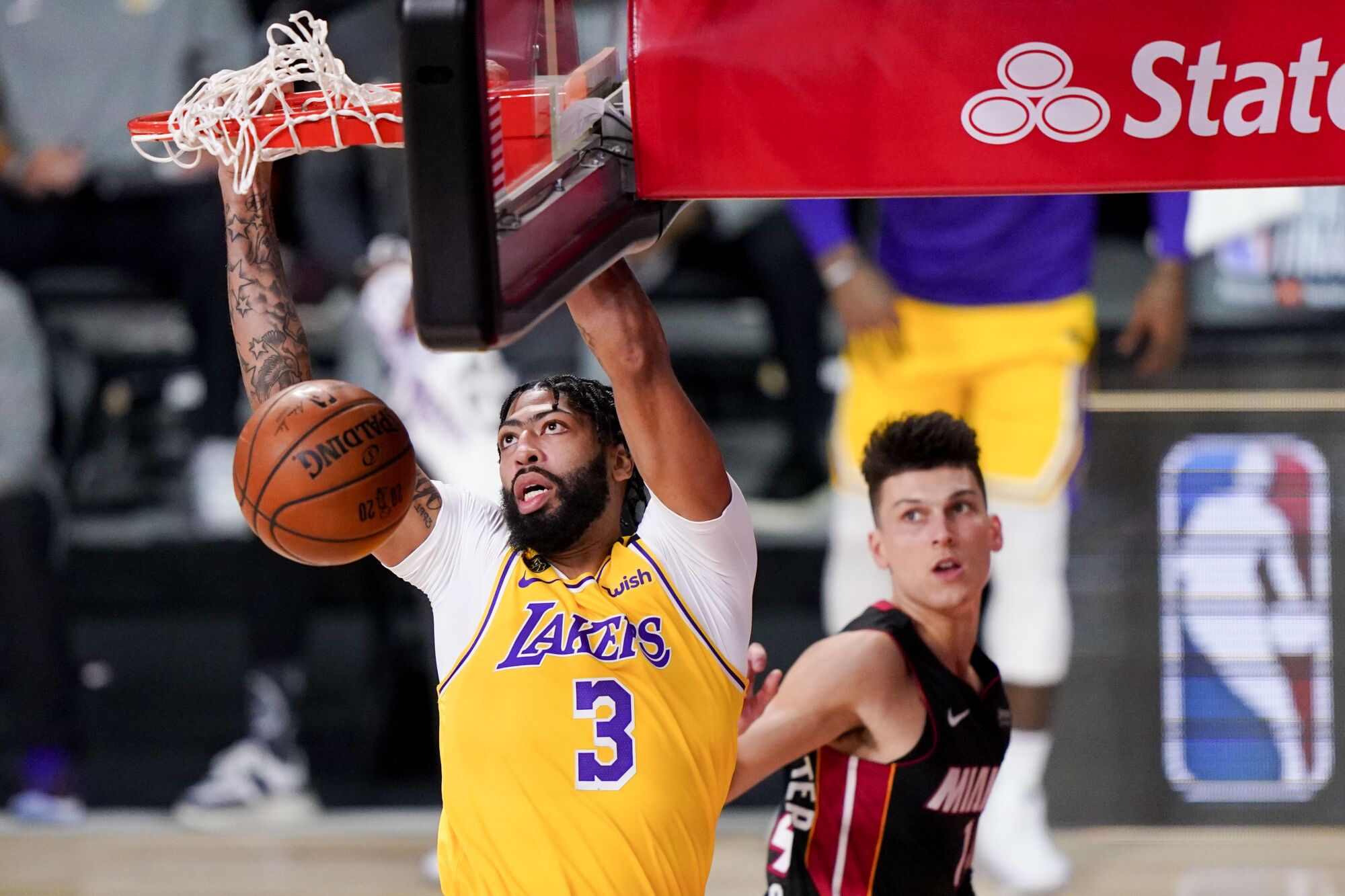 Lakers forward Anthony Davis throws down a dunk against the Heat early in Game 4 on Tuesday night.