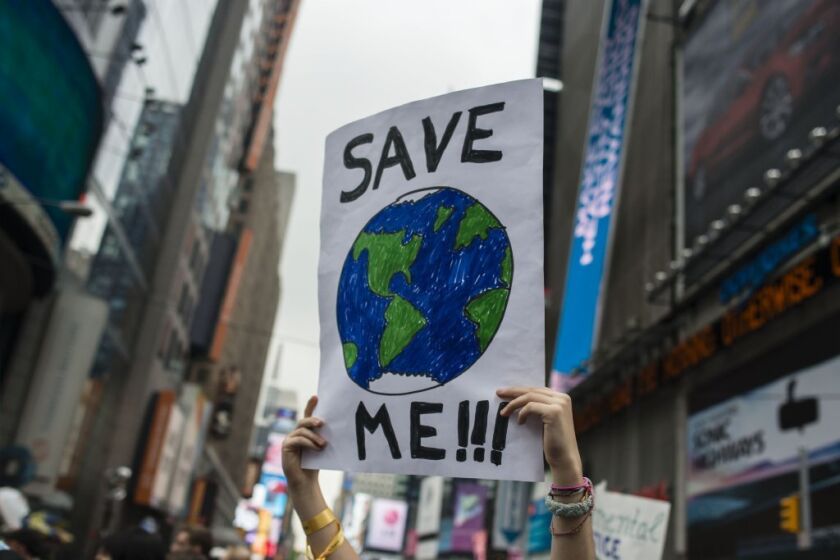 A demonstrator holds up a sign during the People's Climate March in New York on Sunday.