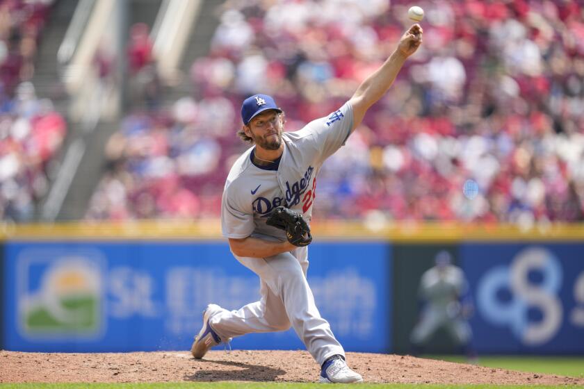 Los Angeles Dodgers starting pitcher Clayton Kershaw (22) throws against the Cincinnati Reds.