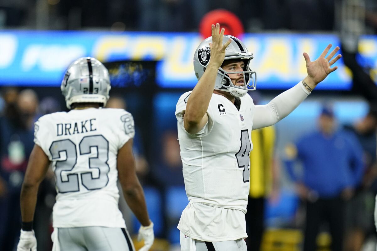 Las Vegas Raiders quarterback Derek Carr reacts during the second half of an NFL football game against the Los Angeles Chargers Monday, Oct. 4, 2021, in Inglewood, Calif. (AP Photo/Ashley Landis)