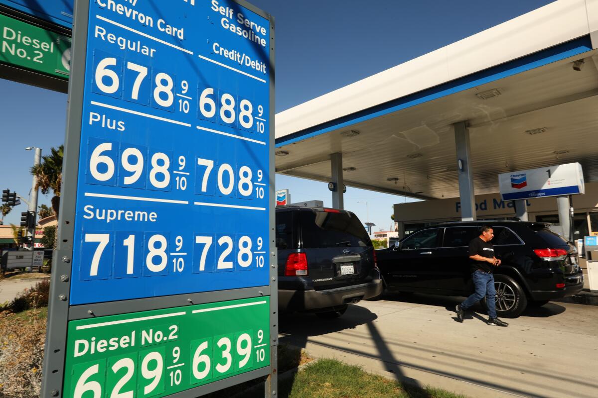 A sign shows gas prices at a Chevron station in Torrance.