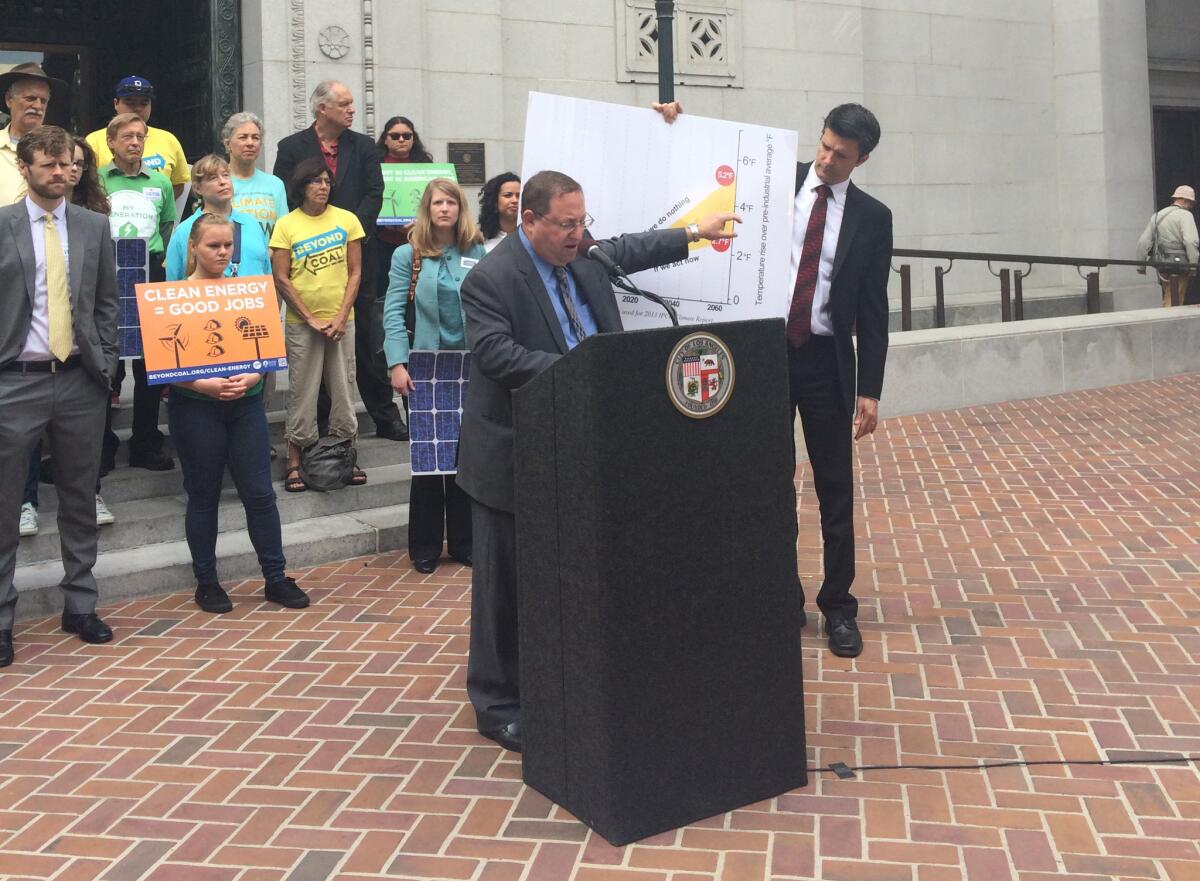 Los Angeles City Councilman Paul Koretz announces his proposed new goals for reducing citywide greenhouse gas emissions at City Hall on Friday.
