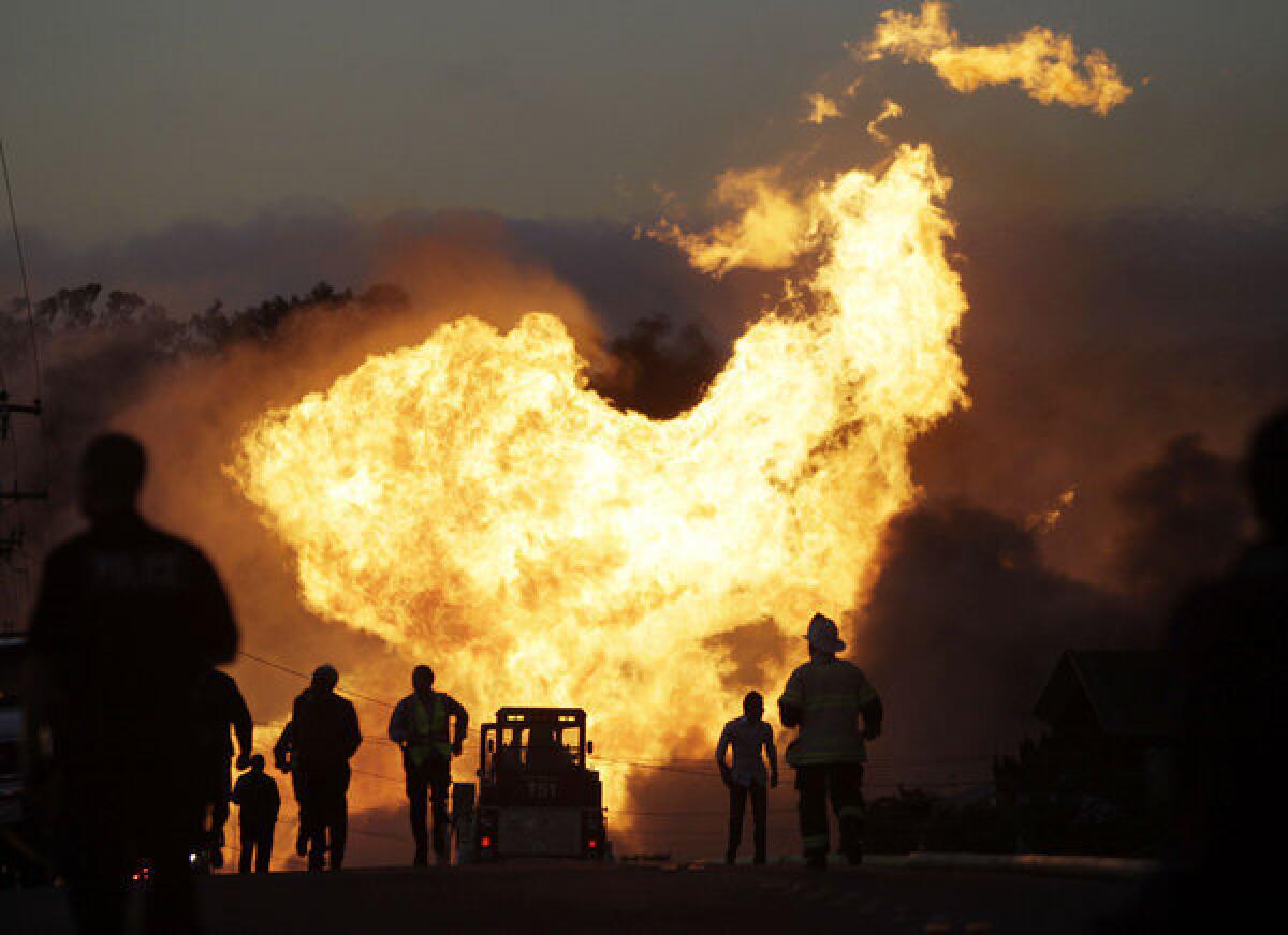 File - In this Sept. 9, 2010 file photo, a massive fire roars through a mostly residential neighborhood in San Bruno, Calif. The California agency investigating a deadly pipeline explosion and the City of San Bruno are set to propose major fines they say Pacific Gas & Electric Co. should pay for its negligence leading up to the blast. The City of San Bruno says the utility's shareholders should pay no less than $1.25 billion for violations regulators say PG&E; committed before the 2010 explosion. (AP Photo/Paul Sakuma, File) ** Usable by LA and DC Only **