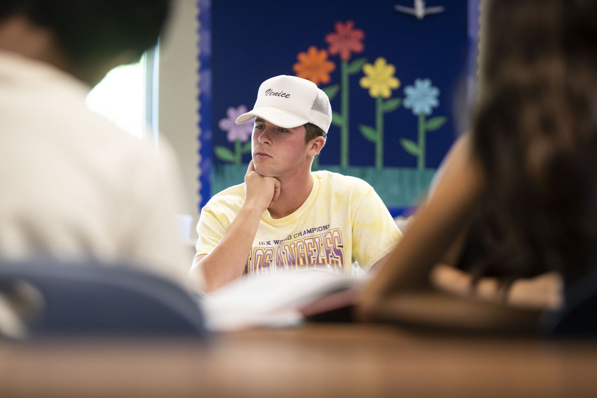 Duran Ferree, 15, center, listens during math class at Del Norte High School.