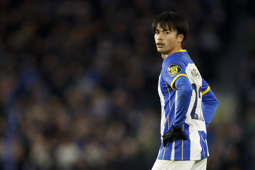 Brighton's Kaoru Mitoma in action during the English Premier League soccer match between Brighton and Hove Albion and Bournemouth at the Amex Stadium in Brighton, England, Saturday, Feb. 4, 2023. (AP Photo/David Cliff)