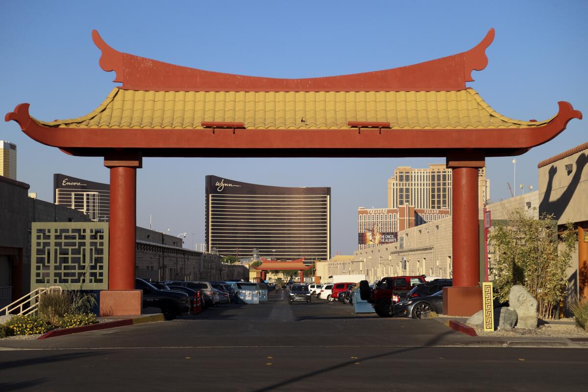 A pailou frames the Wynn Las Vegas at Chinatown Central Plaza in Las Vegas.