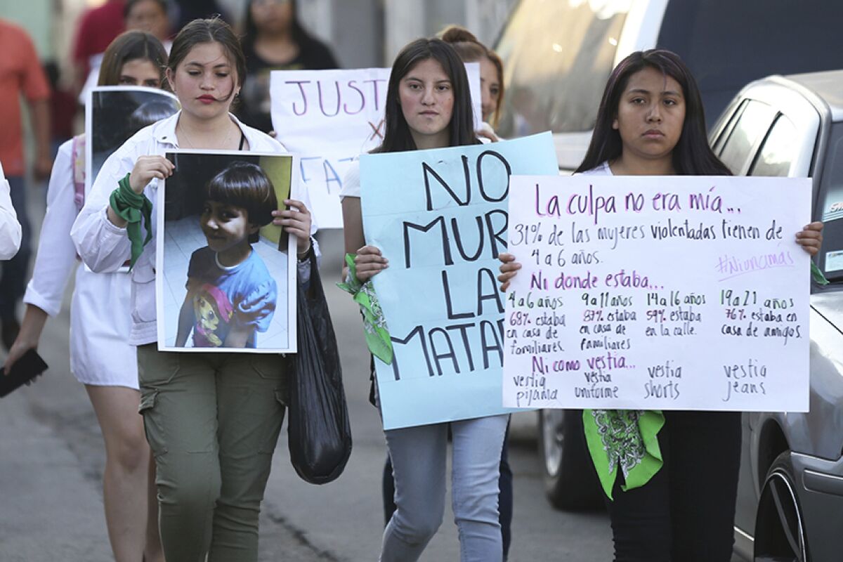 A photo of 7-year-old Fatima is displayed during a march Feb. 17 in Mexico City to protest her murder.