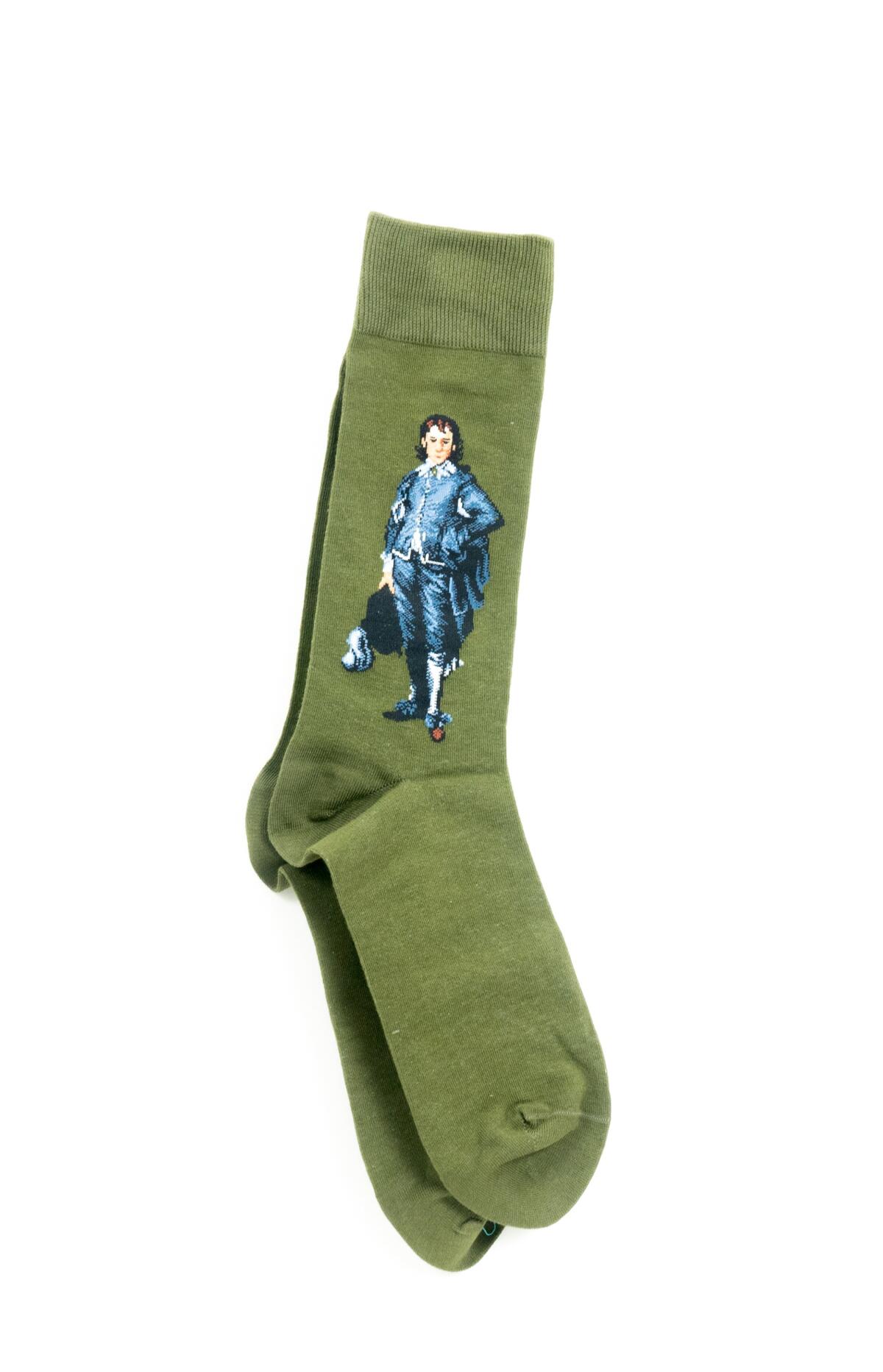 Green socks bearing the image of a man dressed in blue. 