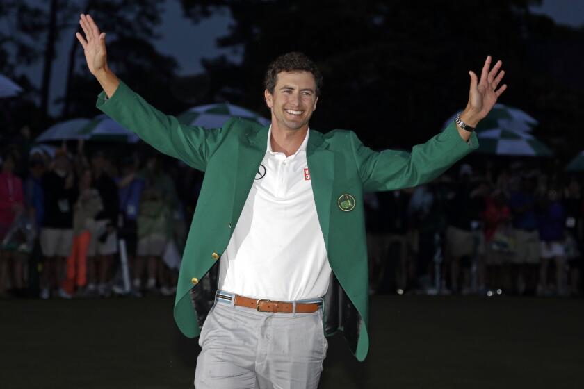 Adam Scott enjoys the moment after becoming the first Australian to win the Masters tournament.