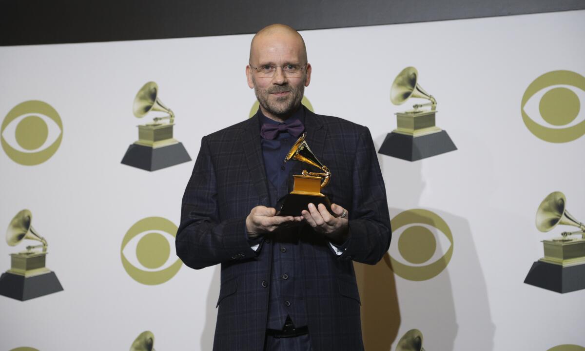Grammy winner Morten Lindberg holding his long-awaited trophy backstage at Sunday's ceremony.