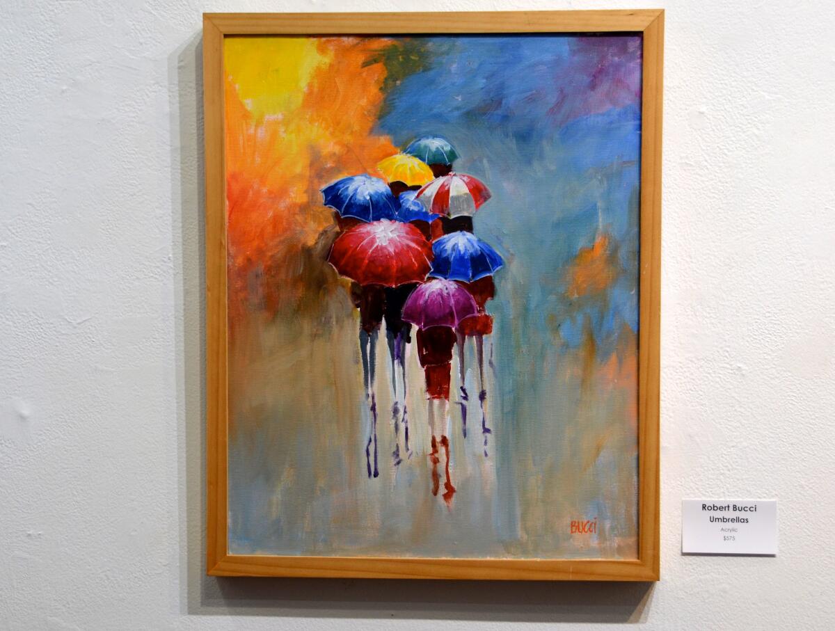 Artist Robert Bucci's acrylic "Umbrellas" is on exhibit at the South Coast Plaza Village Showcase Gallery.