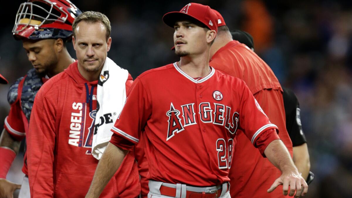 Angels starting pitcher Andrew Heaney leaves the game during the third inning because of an undisclosed injury.