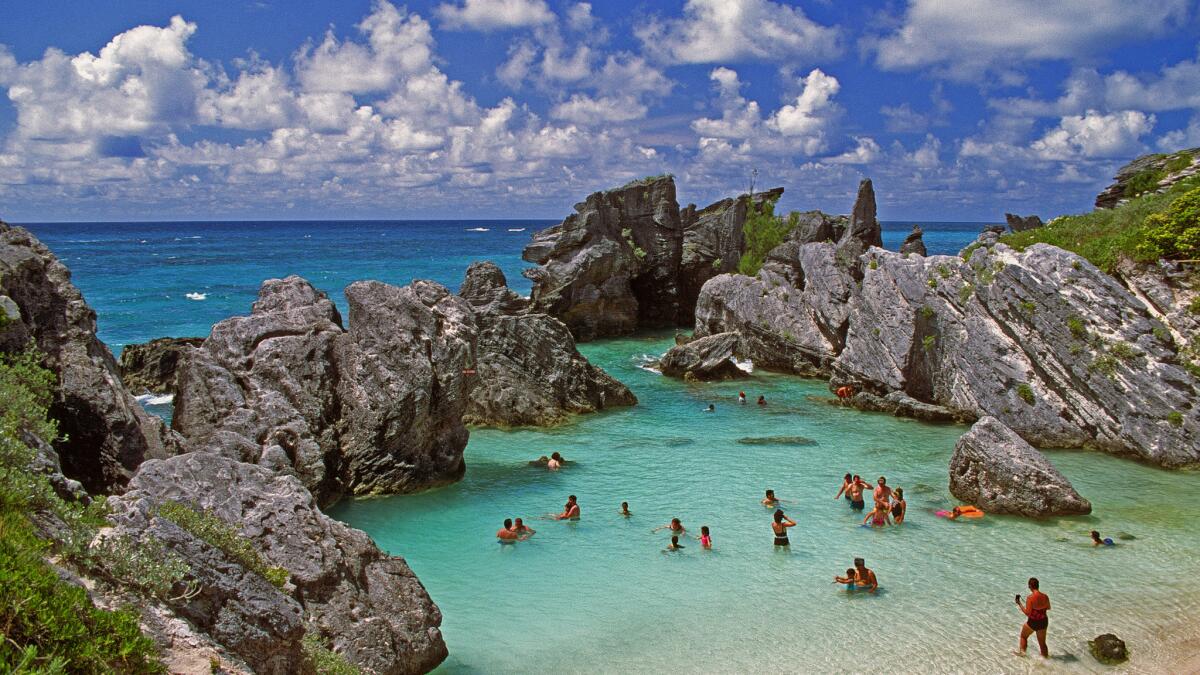 People enjoy the beach next to Horseshoe Bay in Bermuda. Delta is offering a $347 round-trip fare from LAX.