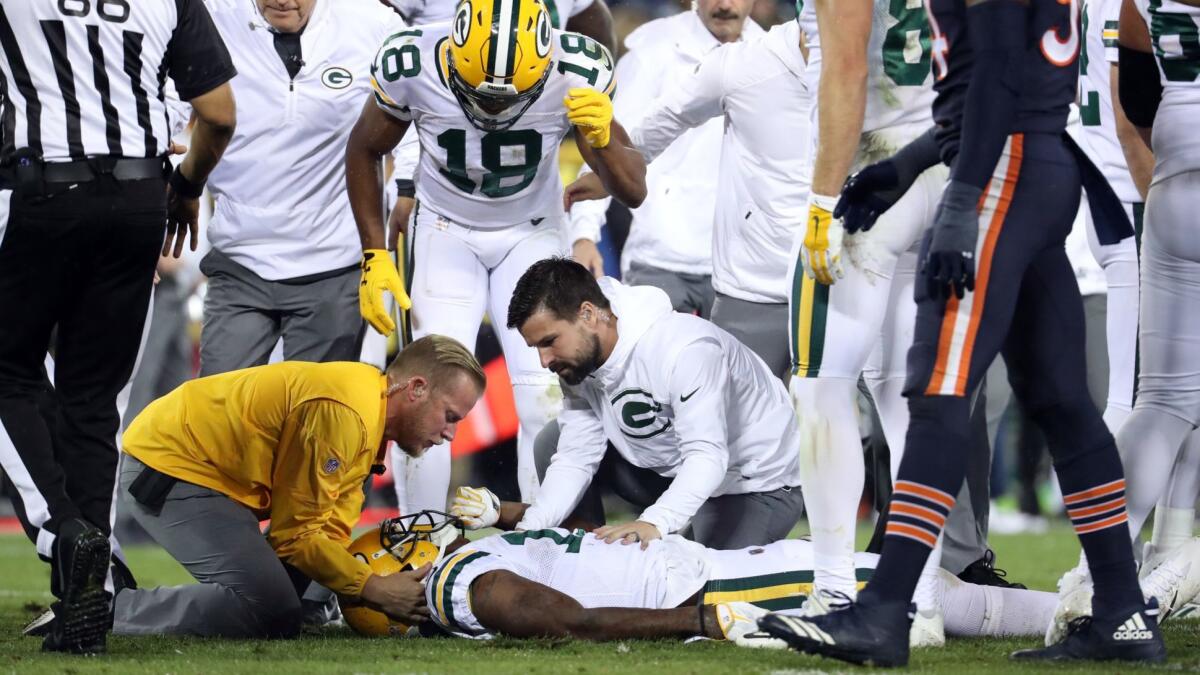 Green Bay Packers wide receiver Davante Adams is injured after a hit by Chicago Bears inside linebacker Danny Trevathan on Sept. 28, 2017, at Lambeau Field.