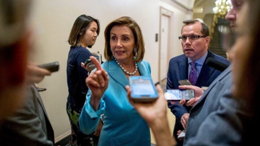 Nancy Pelosi speaks to reporters following a House Democratic caucus meeting July 10, 2019, on Capitol Hill.