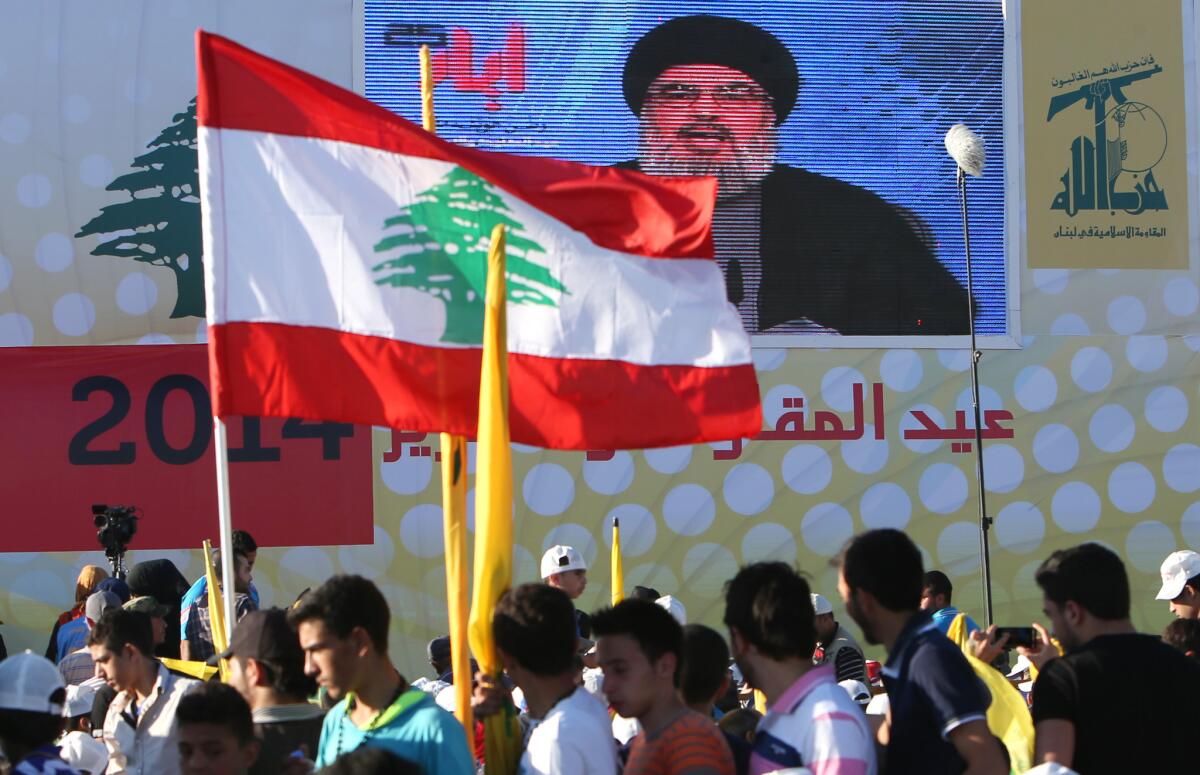 Hezbollah leader Hassan Nasrallah, seen on a large video screen, delivers a speech during a rally in southern Lebanon in May.