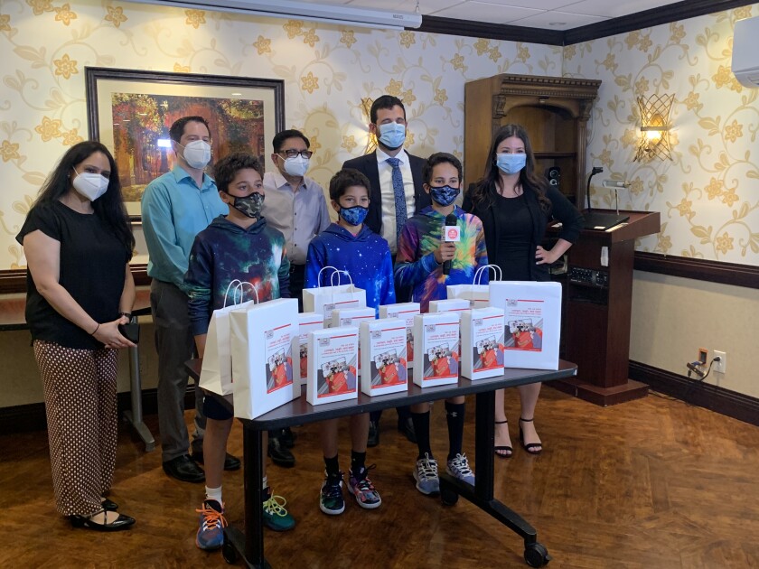 The Tech-Angels Keanu, Milaan and Jaiden Seeliger making a donation to a nursing home in New Jersey.