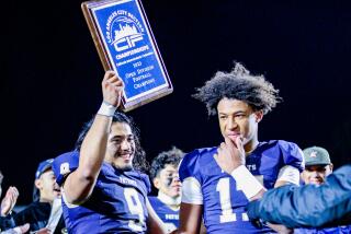 Seniors Maynor Morales (left) and Peyton Waters celebrate winning three consecutive City titles for Birmingham 