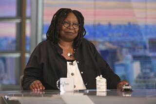 Whoopi Goldberg smiles on the set of 'The View'