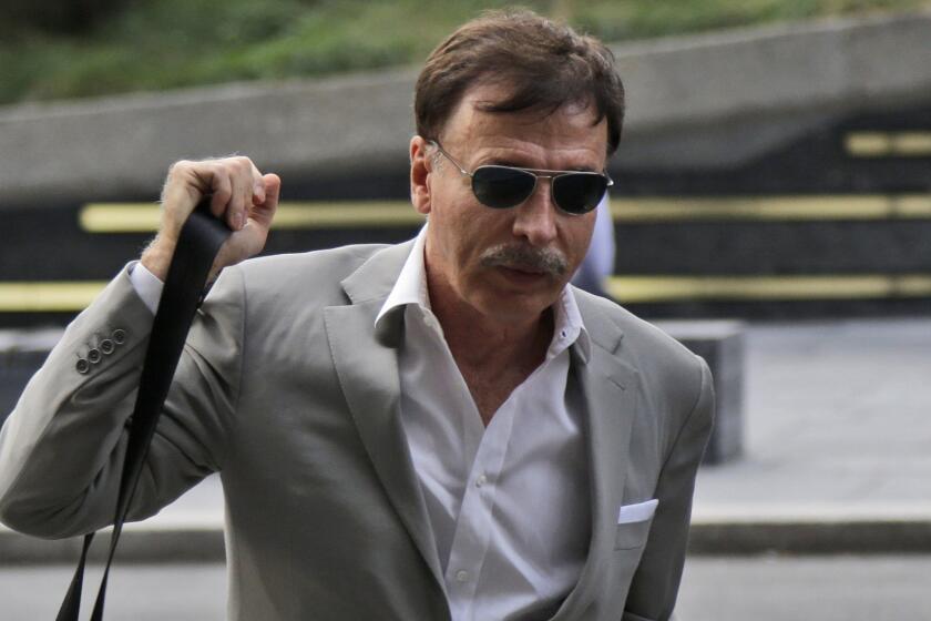St. Louis Rams owner Stan Kroenke arrives at the NFL meetings in New York on Oct. 7. A group that includes Kroenke has donated more than $100,000 to government officials in Inglewood, Calif.
