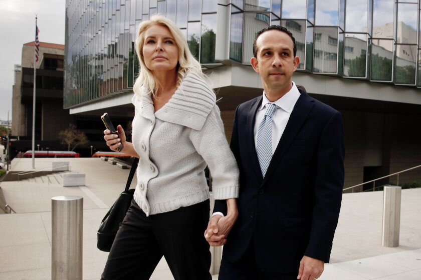 LOS ANGELES CA, MARCH 12, 2020 - Mitch Englander leaves Federal Courthouse in Downtown Los Angeles with his wife Jayne, Thursday March 12, 2020. Englander is accused of obstructing an investigation into his allegedly accepting gifts from a businessman during trips to Las Vegas and Palm Springs. He faces seven federal criminal counts -- three of witness tampering, three for allegedly making false statements and a single count of scheming to falsify facts. (Al Seib / Los Angeles Times)