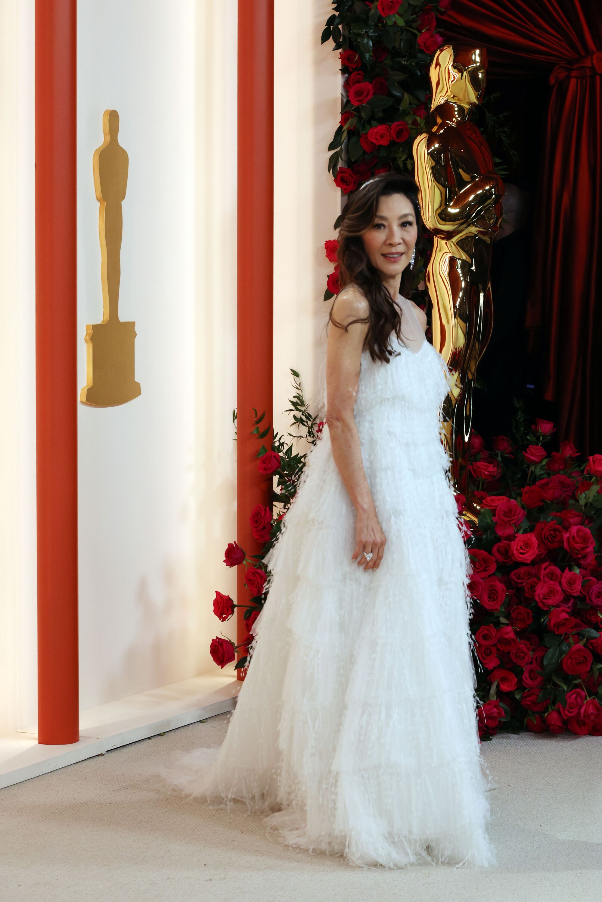 Michelle Yeoh in a white, flowing, cloudlike gown.
