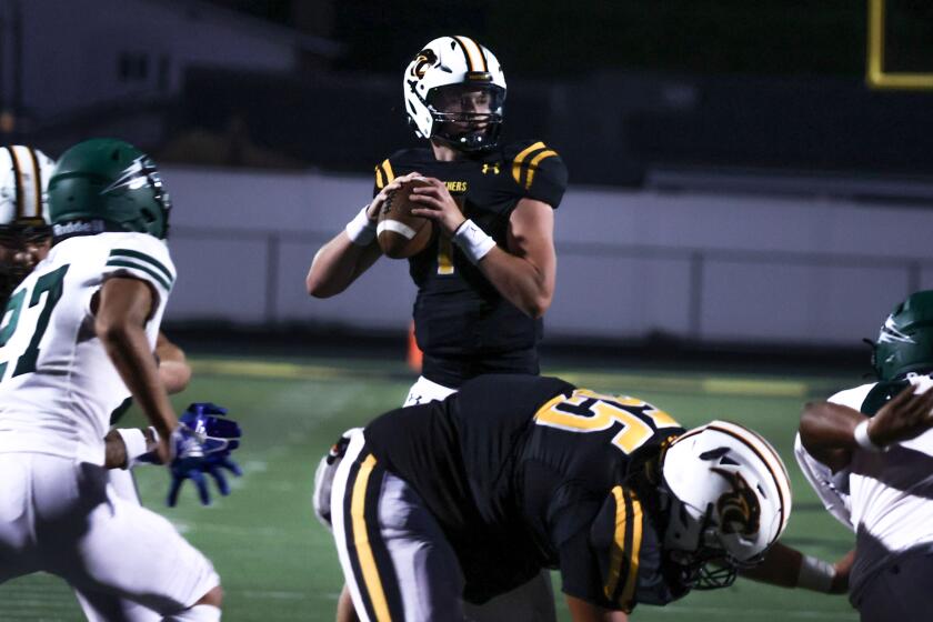 Newbury Park, CA - September 06: Newbury Park Quarterback Brady Smigiel (7) looks down.