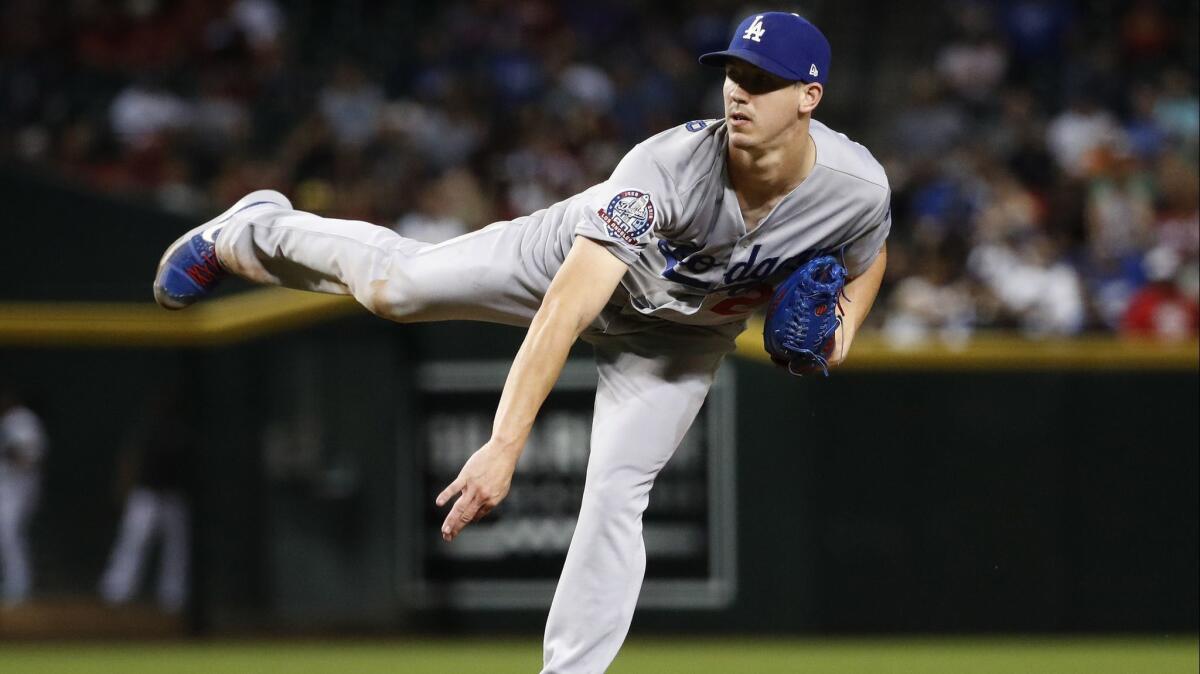 Dodgers starting pitcher Walker Buehler throws against the Arizona Diamondbacks during the sixth inning on Tuesday in Phoenix.