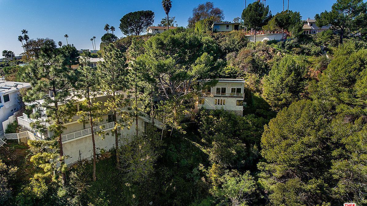 The Brentwood estate sits on about half an acre of grounds with canyon and mountain views.