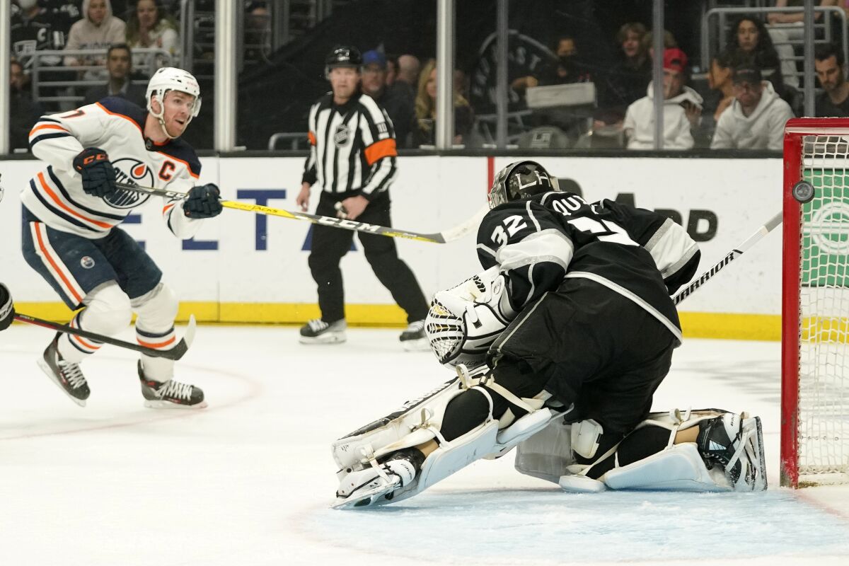 Edmonton Oilers center Connor McDavid, left, sores on Kings goaltender Jonathan Quick during a 3-2 Oilers win on April 7.