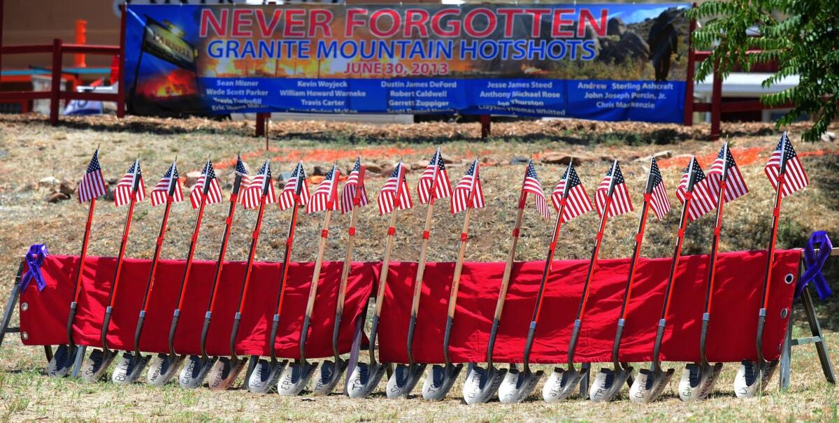 Flag-topped shovels with the names of the Granite Mountain Hotshots on their blades were a grim reminder of the tragedy that occurred two years ago as residents gathered June 28 for the Remembrance Event of the 2nd anniversary of the Yarnell Hill Fire in Arizona. Nineteen firefighters died on June 30, 2013, when the men were overrun by flames in a brush-choked canyon.