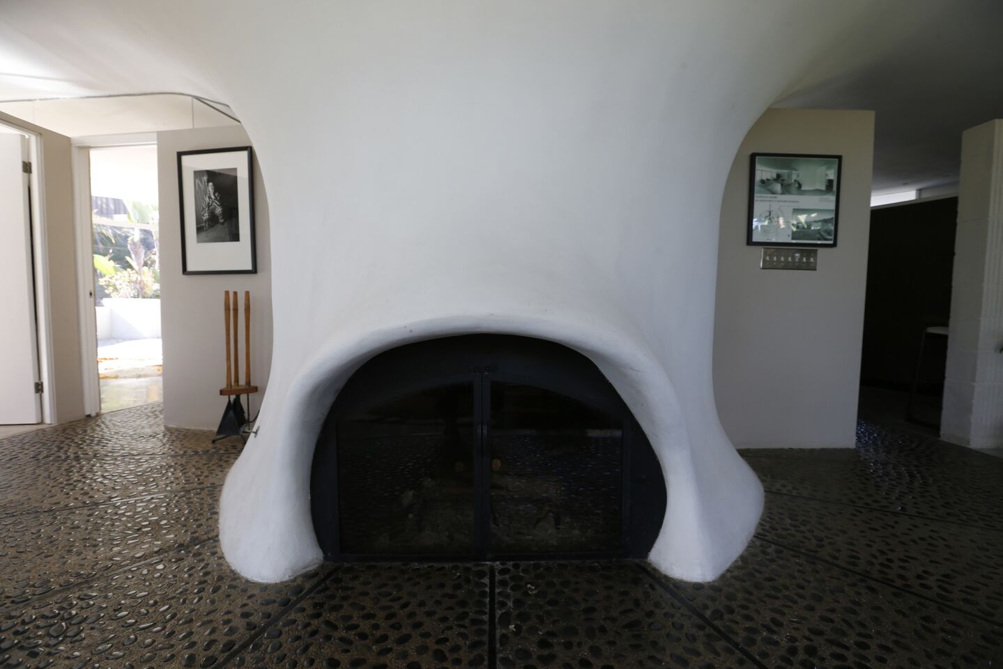 Einar Johnson and Pat Gough's sprayed-on “shotcrete” fireplace was hand-finished into a free-form, organic shape.