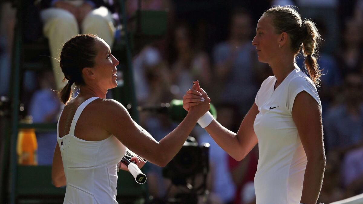 Jelena Jankovic, left, shakes hands with Petra Kvitova after her third-round victory at Wimbledon on Saturday.