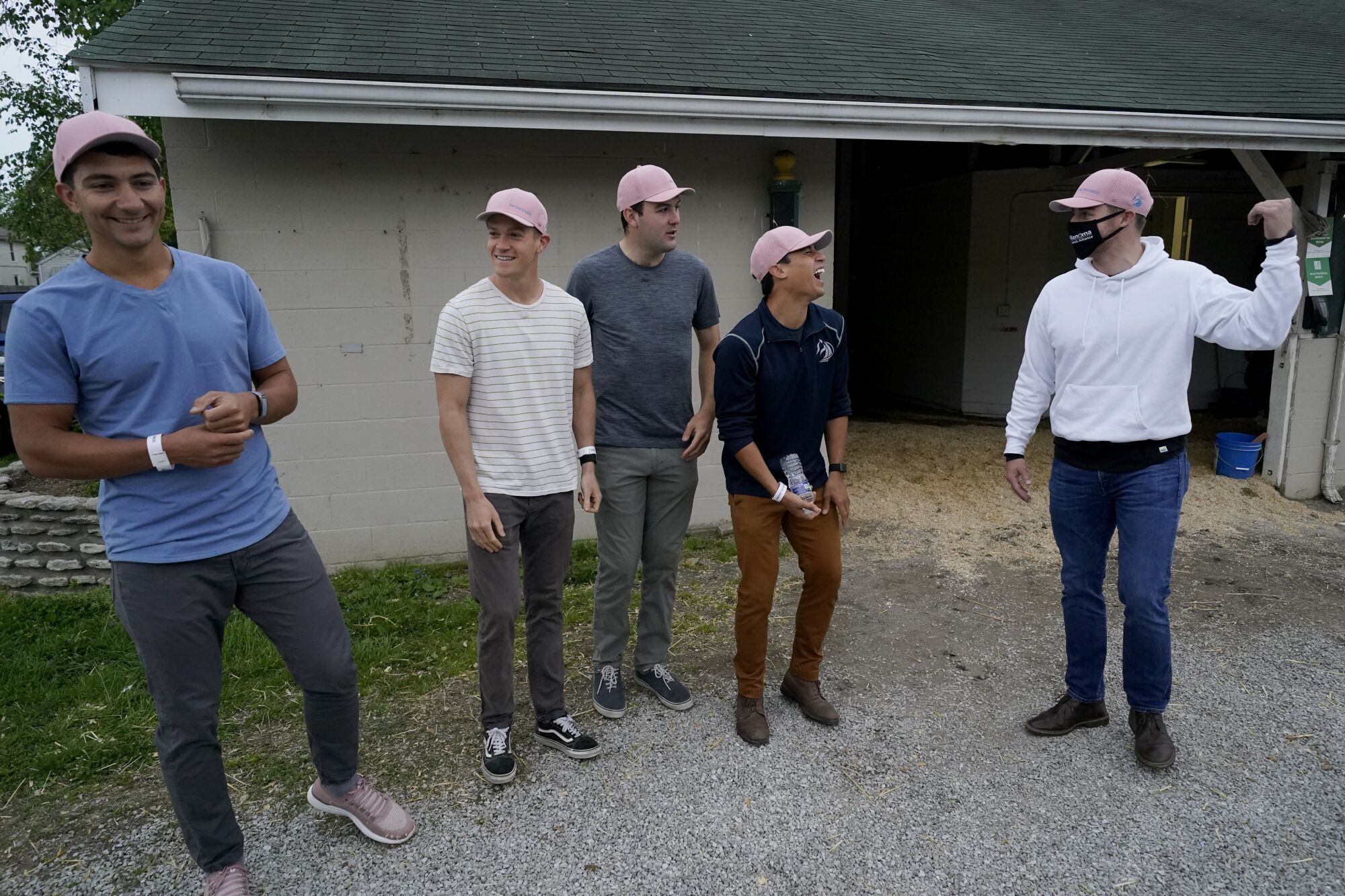 Former teammates Dan Giovacchini, Reiley Higgins, Alex Quoyeser, Patrick O'Neill and Eric Armagost stand outside a barn 