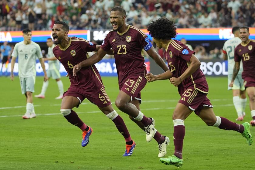 Venezuela's Salomon Rondon, center, celebrates scoring his side's opening goal from the penalty spot during a Copa America
