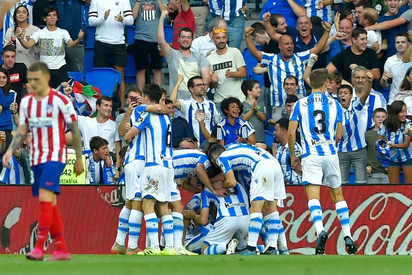 Real Sociedad's players celebrate after Norwegian midfielder Martin Odegaard scored a goal during the Spanish league football match Real Sociedad against Club Atletico de Madrid at The Anoeta Stadium in San Sebastian on September 14, 2019. (Photo by ANDER GILLENEA / AFP)ANDER GILLENEA/AFP/Getty Images ** OUTS - ELSENT, FPG, CM - OUTS * NM, PH, VA if sourced by CT, LA or MoD **