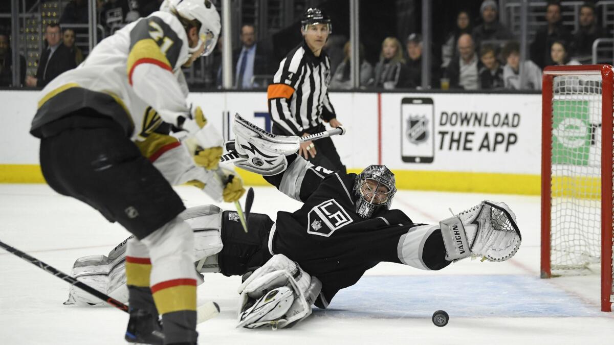 Kings goaltender Jonathan Quick stops a shot by Vegas left wing Tomas Tatar on Feb. 26.