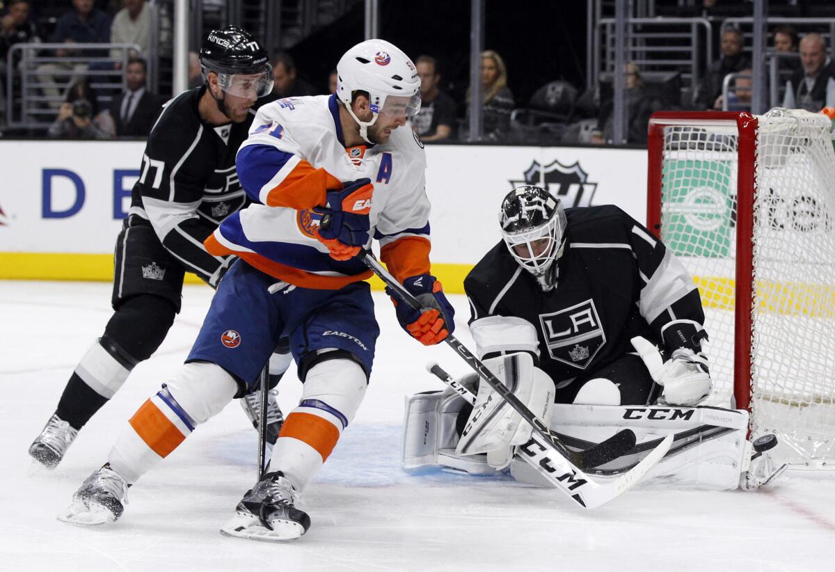 Kings goalie Jhonas Enroth stops a shot from New York Islanders center Frans Nielsen during the first period of a game on Nov. 12.