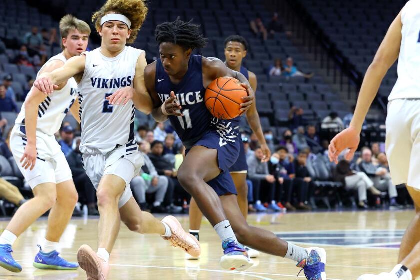 Tyler Hunt of Venice drives to the basket against Pleasant Valley. 