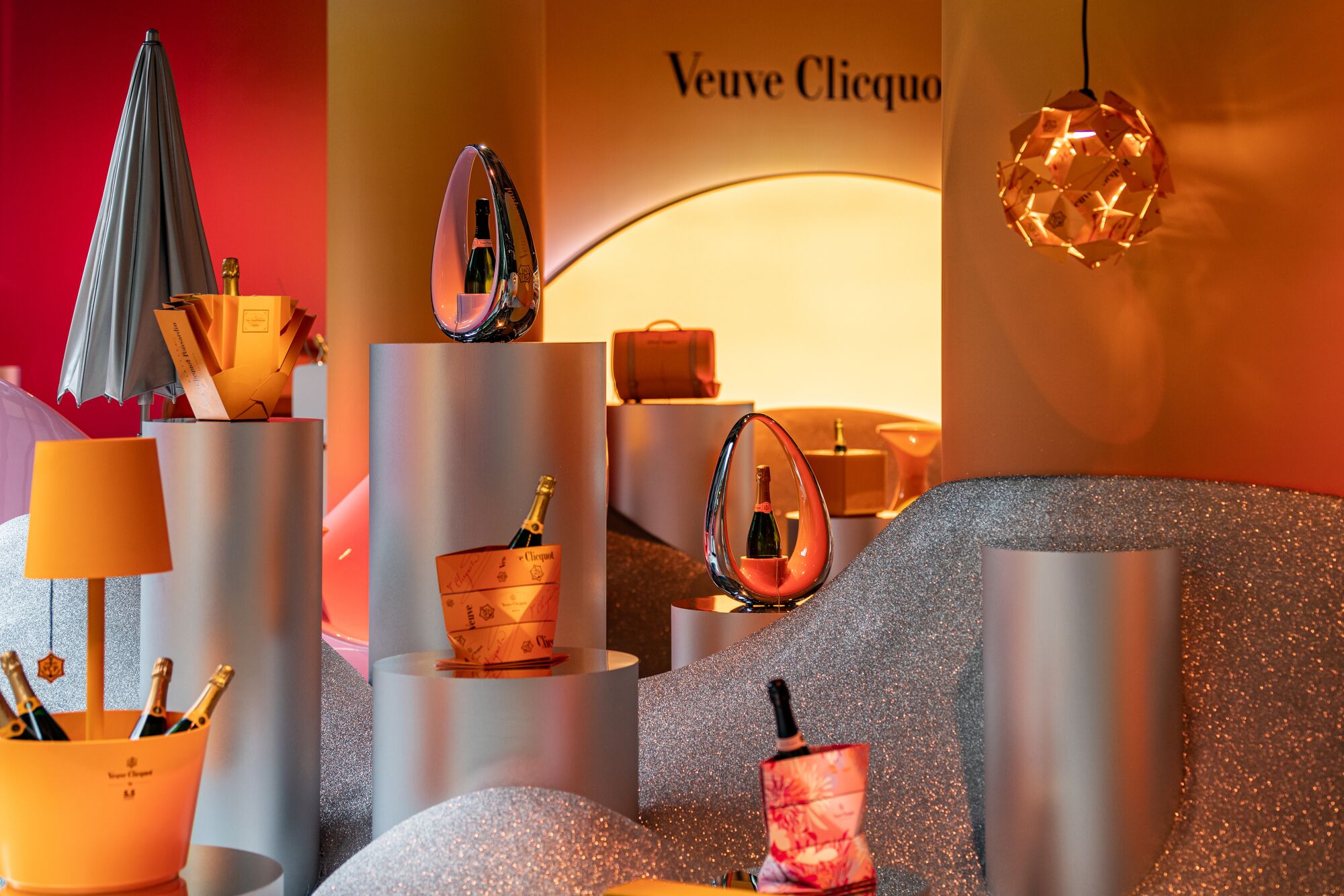 A display of several Champagne bottles presented in unique ways