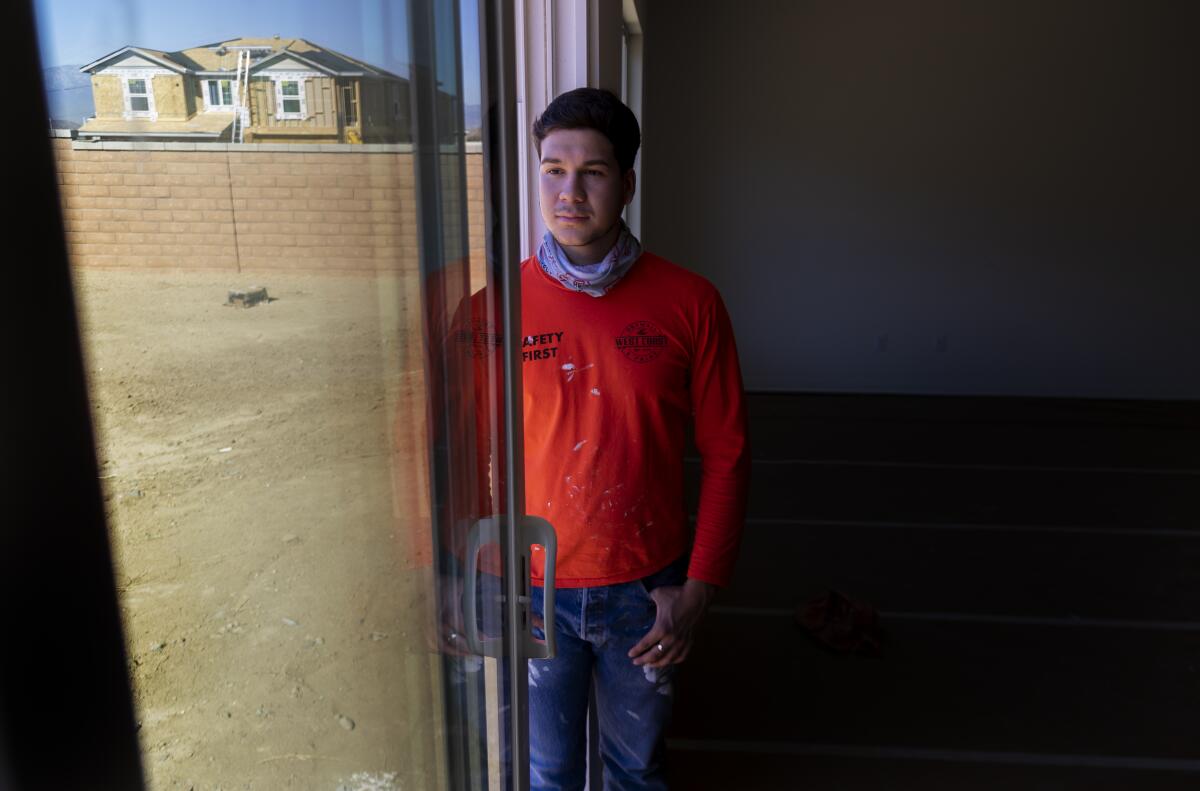 Vincent Aguayo, a first-year student at Cal State Sacramento, is shown at a new housing development in Riverside. 