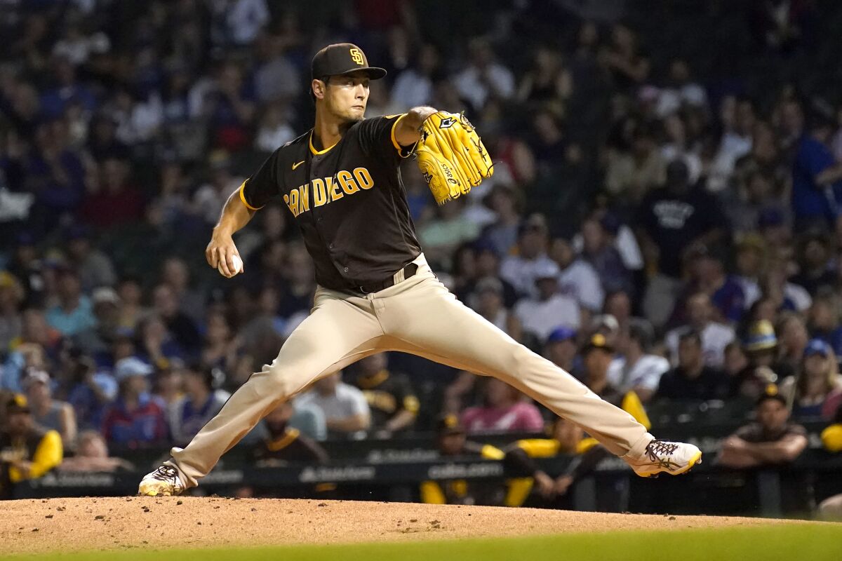 San Diego Padres starting pitcher Yu Darvish winds up during the first inning of a baseball game against the Chicago Cubs Monday, June 13, 2022, in Chicago. (AP Photo/Charles Rex Arbogast)