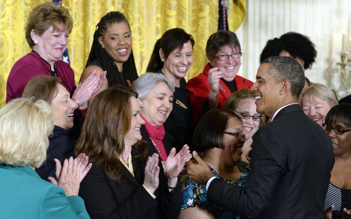 President Obama greets people in the East Room of the White House during an event marking Equal Pay Day on April 8, 2014.