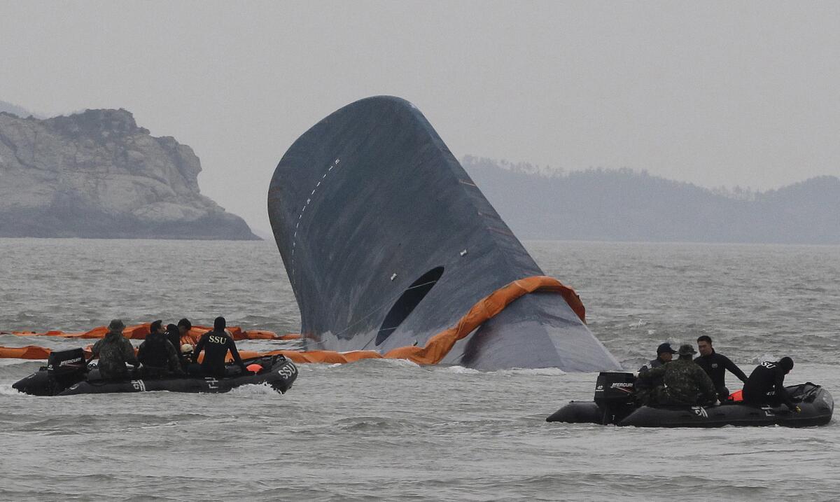 South Korean coast guard crews search for passengers aboard the sunken ferry Sewol in the waters off the southern coast of South Korea in April.