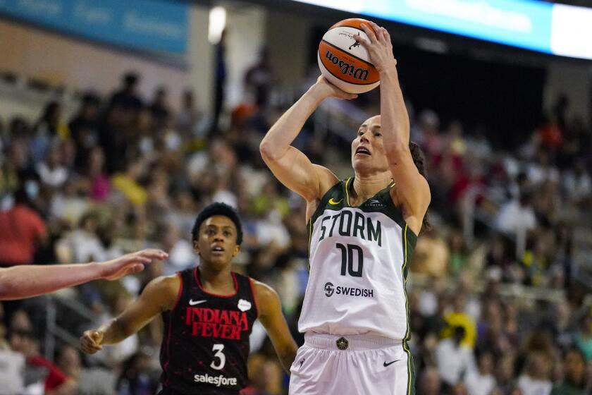 Seattle Storm guard Sue Bird (10) shoots in front of Indiana Fever guard Danielle Robinson (3) in the first half of a WNBA basketball game in Indianapolis, Tuesday, July 5, 2022. (AP Photo/Michael Conroy)