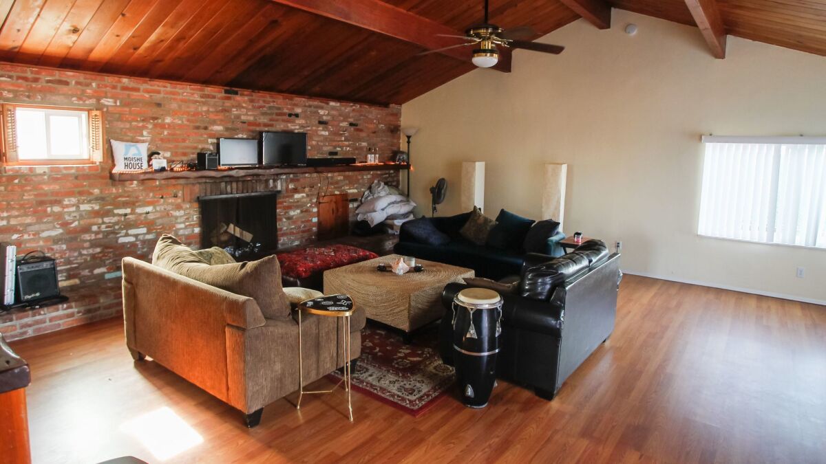 The living room in the Moishe House in Oceanside is large enough for a party and has a conga drum and karaoke machine for musical celebrations.